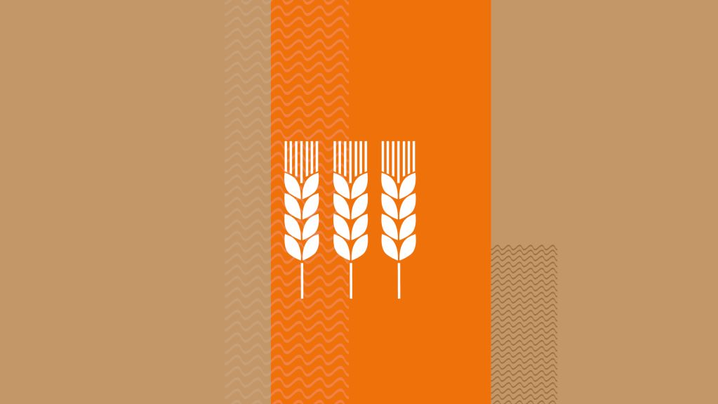 Drei Weizenähren als Symbole auf orange-beigefarbenem Hintergrund